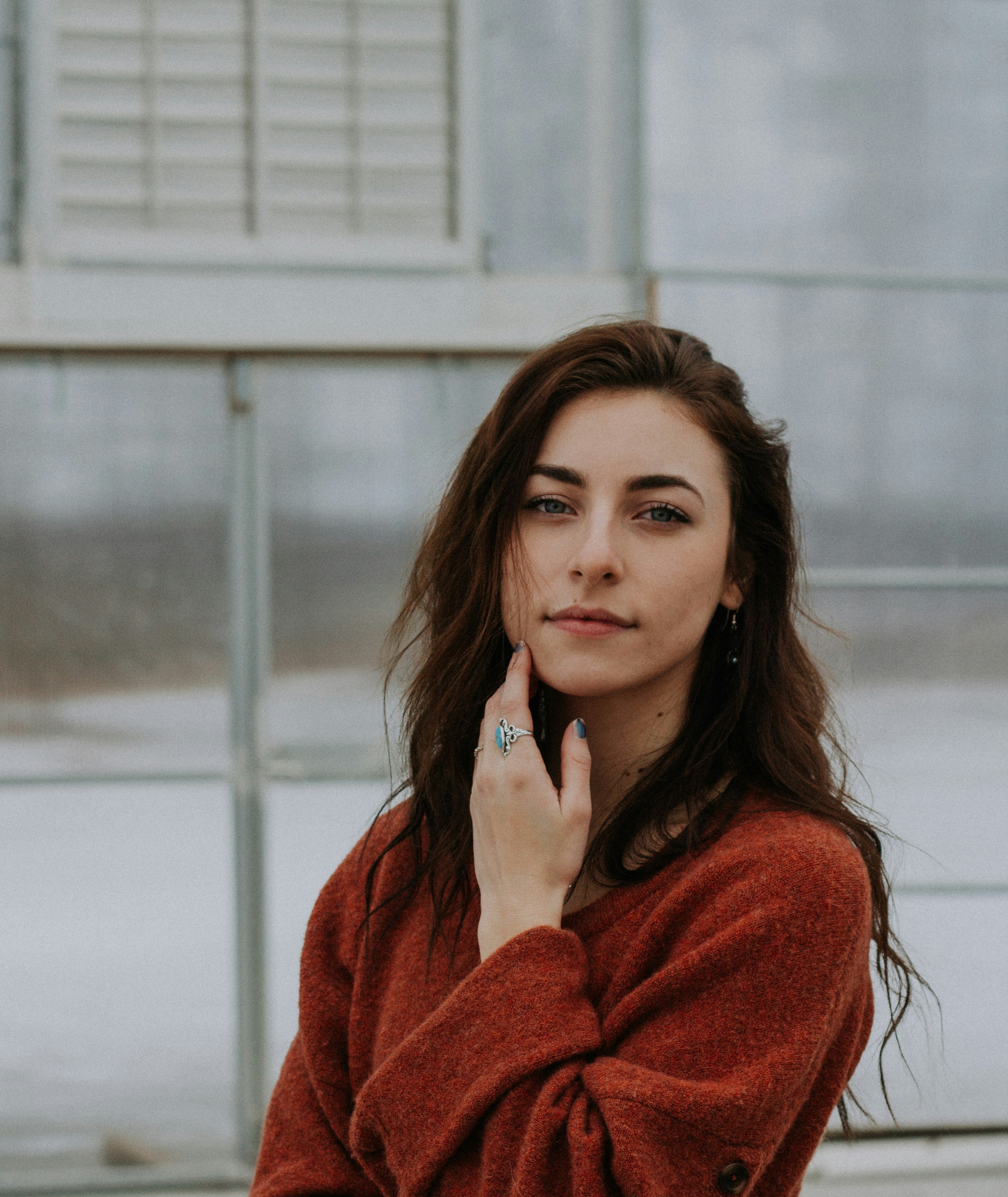 woman holding her chin posing